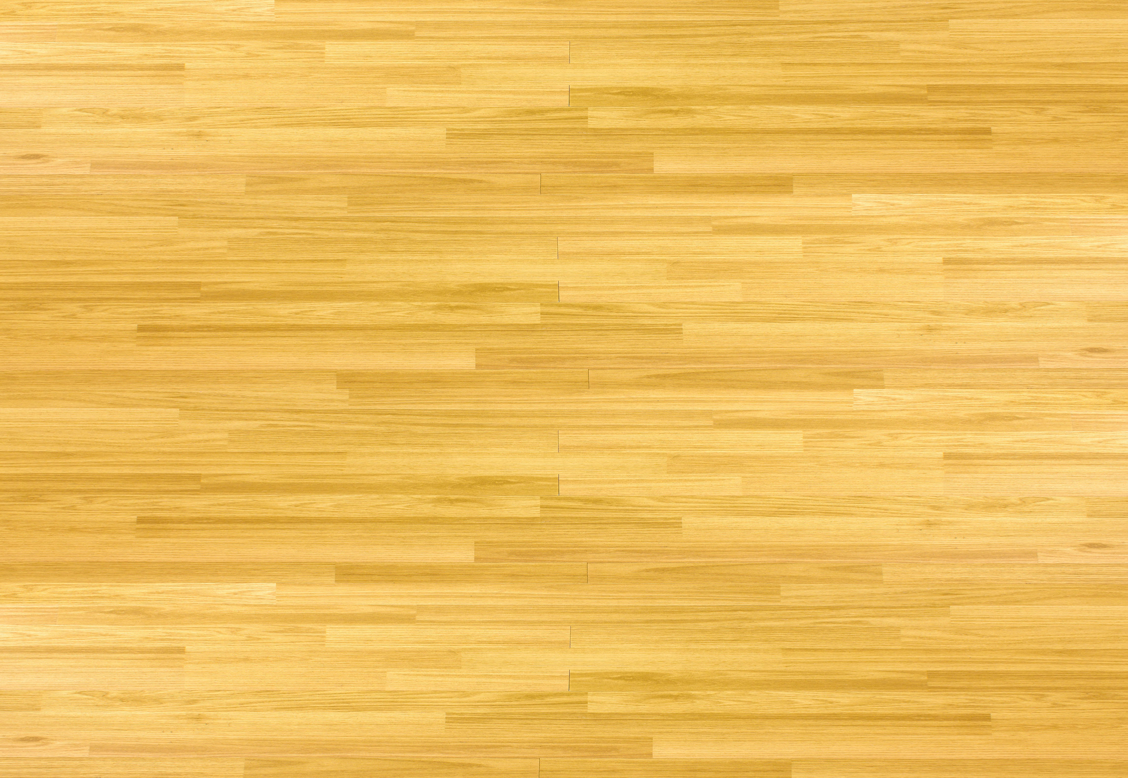 Hardwood maple basketball court floor viewed from above.